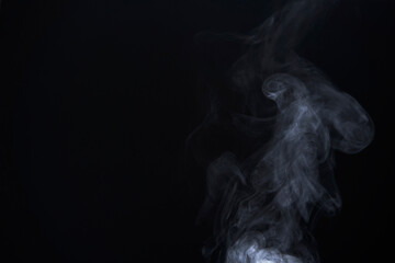 White Smoke Swirls on Black Background for Composite Use
