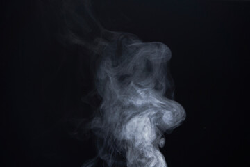 White Smoke Swirls on Black Background for Composite Use
