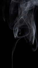 White Smoke Swirls on Black Background for Composite Use
