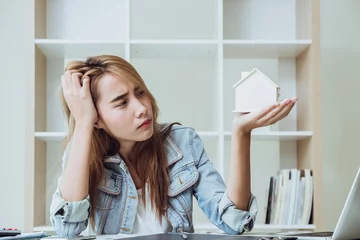 Gordijnen Young women teen in business office looking at home serious stress moody worry about house expense © Quality Stock Arts