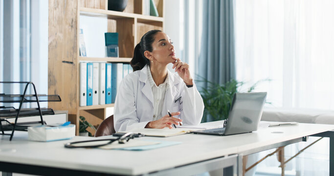 Thinking, woman and doctor with laptop in hospital for medical report or diagnostic research. Ideas, computer and female healthcare worker with brainstorming for treatment plan in clinic office. - Powered by Adobe