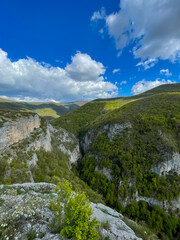 Beautiful scenery on the mountains and forest from the top of the cliff