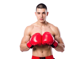 A muscular male boxer with short hair stands in a fighting stance wearing red boxing gloves and matching shorts.