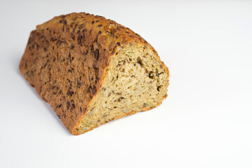 Fitness bread, black grain bread on a white background. Yeast-free bread.