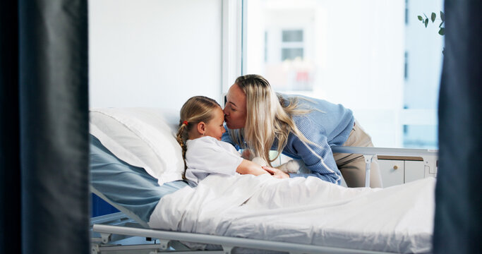 Healthcare, woman or child in bed with kiss, support or care for patient in recovery. Smile, mother and daughter in hospital for treatment, surgery success or single parent comforting with love