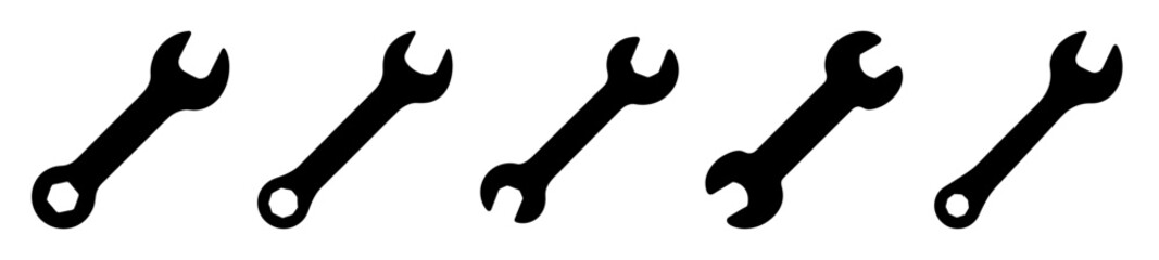Collection of five different wrenches isolated against a plain white background