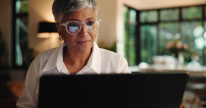 Evening, entrepreneur and woman with laptop, home and application for funding on website or freelance. Working late, online and mature person with business plan for bank loan, remote work or deadline