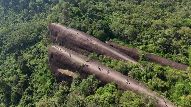 Aerial view of an iconic Three Whales Rock (in Thai called Hin Sam Wan) a 75-million-year-old rock formation protruding out of a mountain in Phou Sing, Bueng Kan Province, Thailand.