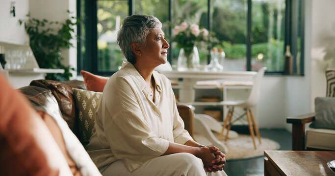 Relax, thinking and senior woman on sofa in home with memory, nostalgia or reflection on weekend. Calm, peace and elderly female person with decision, choice or planning in living room at house.