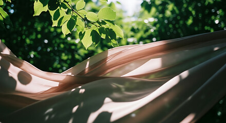 Ethereal Pink Fabric Flowing in Sunlit Green Foliage with Dappled Shadows