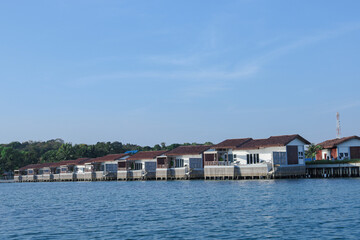 Fototapeta premium Luxury overwater bungalows tropical island resort vacation getaway