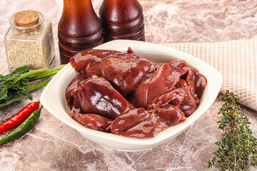 Raw uncokked chicken liver in the bowl