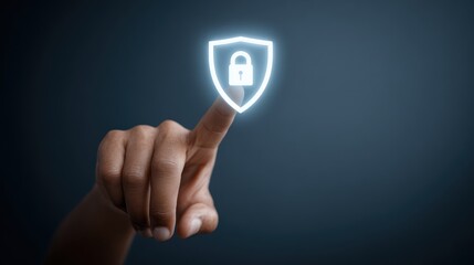 Fototapeta premium Hand Pointing at Shield Icon Representing Cybersecurity and Protection