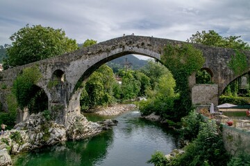 Roman Bridge of Cangas de Onís with Hanging Cross – Historic Landmark in Asturias, Spain