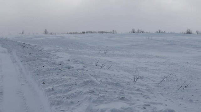 Difficult winter roads in the wide open spaces of Arctic forest-tundra. There is no way here in summer. Russia, Komi Republic oil and gas region, former Soviet Gulag. Siberia