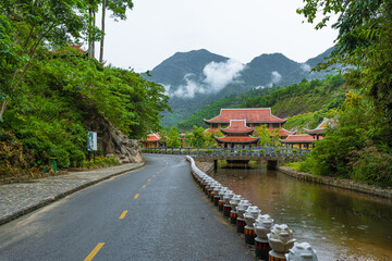Vietnamese Picturesque Village Near River Among Mountains And Jungle