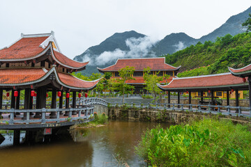 Vietnamese Picturesque Village Near River Among Mountains And Jungle
