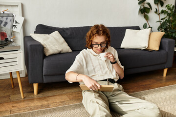 Obraz premium Cozy moments of a young man enjoying a peaceful afternoon at home with a cup of coffee