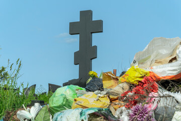 Overflowing Trash Bin at Cemetery. A Silent Witness to Forgotten Memories and Neglect. The...
