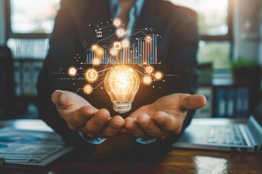 Businessperson holds glowing lightbulb with financial data overlay