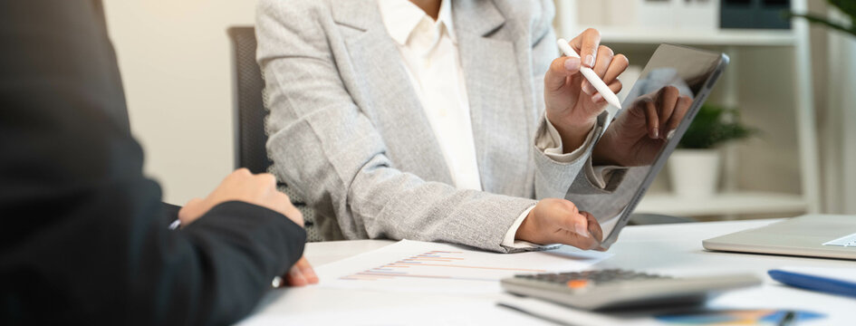 Financial consult planning investor asses and present to client, Close up shot client and advisor review investment strategy in the office.