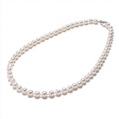 Simple pearl necklace laid in an open spiral