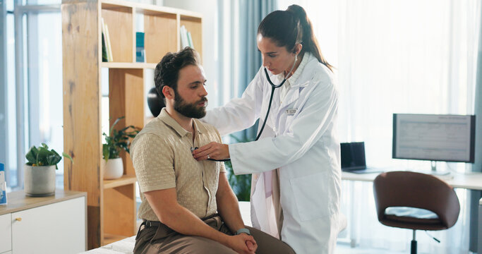 Hospital, listening and doctor with stethoscope for man for diagnosis, consulting and breath exam. Healthcare, clinic and patient with tools for cardiology, pulmonary service and medical checkup