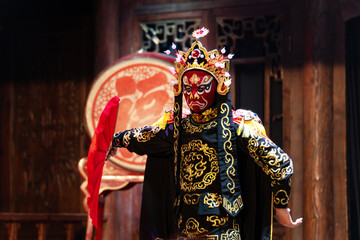 Chinese actor performs a public traditional changing face performance onstage in Chengdu, China