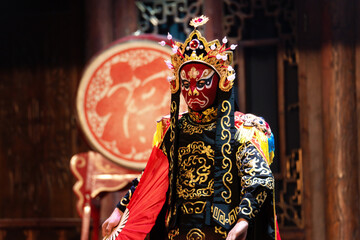 Chinese actor performs a public traditional changing face performance onstage in Chengdu, China