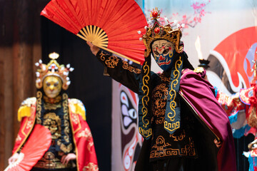 Chinese actor performs a public traditional changing face performance onstage in Chengdu, China