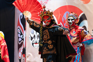 Chinese actor performs a public traditional changing face performance onstage in Chengdu, China
