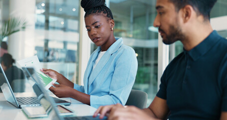 Obraz premium Office, colleagues and people with data, document or graphs for financial performance, read or tech. Collaboration, man and woman with paperwork for sales, account manager and discussion with laptop