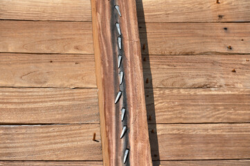 Wooden ship planks reinforced with nails