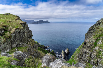 Steep Ocean Cliff With Seabirds and a Serene Sea Horizon, Runde, Norway