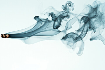 Dynamic smoke effect in cobalt blue tones creating an abstract design in a tranquil space