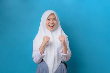 Indonesian High School Student Showing Excitement and Motivation on Blue Background