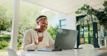 Happy, black woman and winning with laptop for good news, online getaway or prize at home. Excited, person or celebration with smile on computer for bonus, accommodation deal or earphones at house