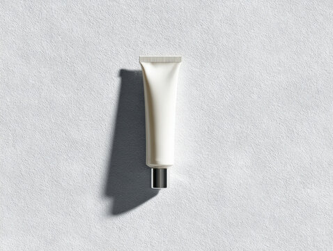 High detail top down image of single sunscreen tube, showcasing its sleek design and soft shadows on textured surface, evokes sense of simplicity and elegance