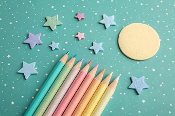 Pastel colored pencils and stars night sky scene