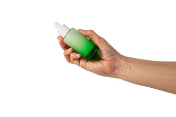 Green glass cosmetic bottle, Skin care or sunscreen cosmetic with hand on transparent background.