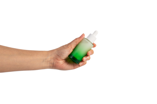 Green glass cosmetic bottle, Skin care or sunscreen cosmetic with hand on transparent background.