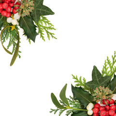 Winter solstice nature Christmas background border on white. Traditional flora of holly, ivy, fir,...