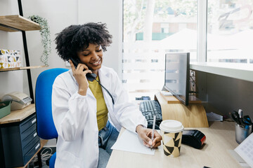 Friendly medical receptionist scheduling appointments and answering patient inquiries, ensuring...
