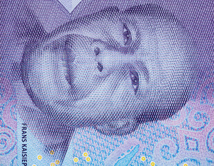 Macro of man on indonesian ten thousand Rupiah bank note