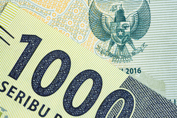 Macro of one thousand indonesian Rupiah bank note currency number value