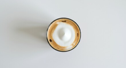 Fototapeta premium Top-Down View of a Perfectly Poured Cappuccino with a Concentric Milk Foam Design in a Dark Ceramic Cup