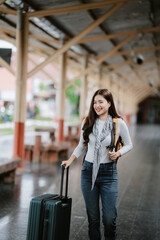 A young woman walking on a train station