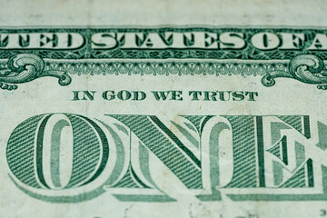 Frontal macro of big letters ONE on one dollar US America currency bill in god we trust