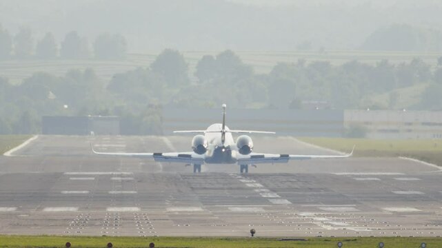 Excitement builds as a commercial plane gracefully lands on a serene runway at twilight