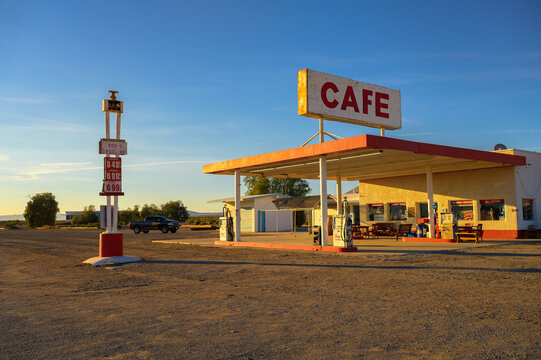 Amboy, California, USA - November 04, 2023 : Roy's vintage cafe and gas station with neon sign in Amboy along historic Route 66 in Mojave Desert.